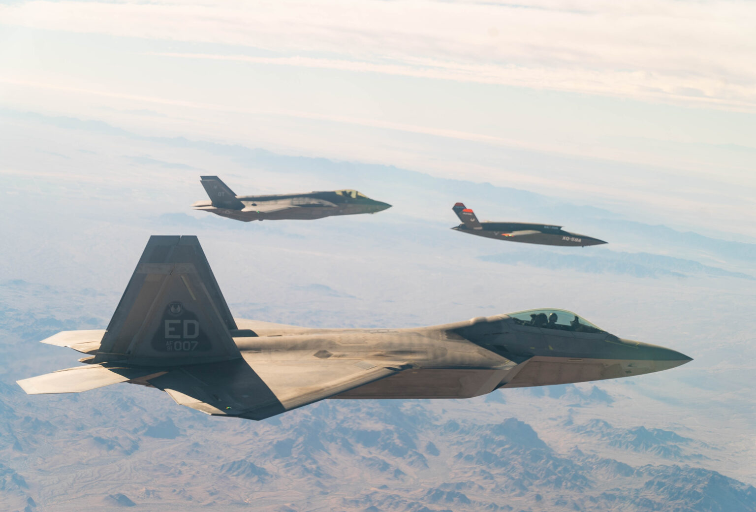 F-35, F-22 and XQ-58 Valkyrie. Unmanned-mannedn team up. UAS, UAV, UCAS, UCAV, Drones.